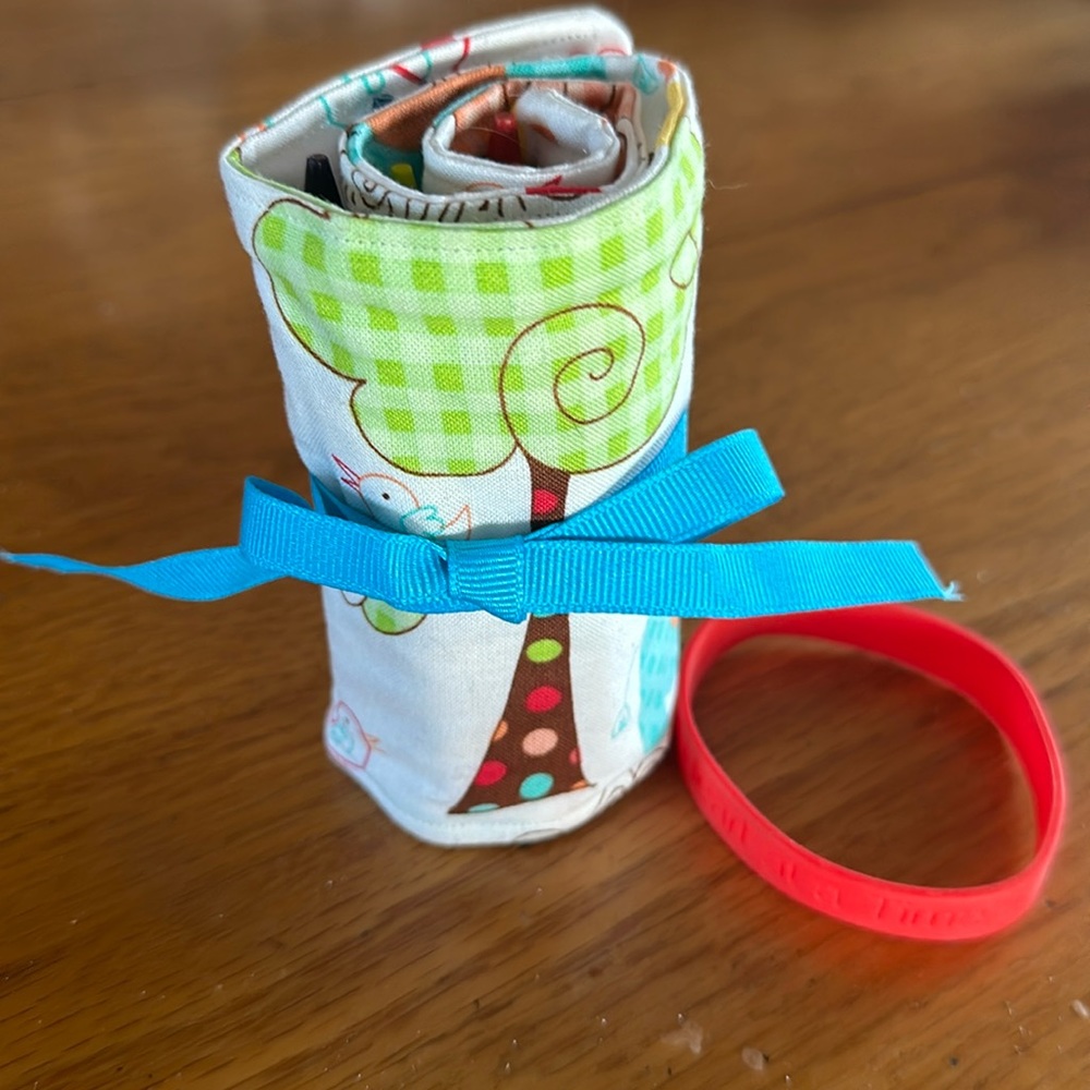 Handcrafted Crayon Cozy with blue tie and 16 crayons included